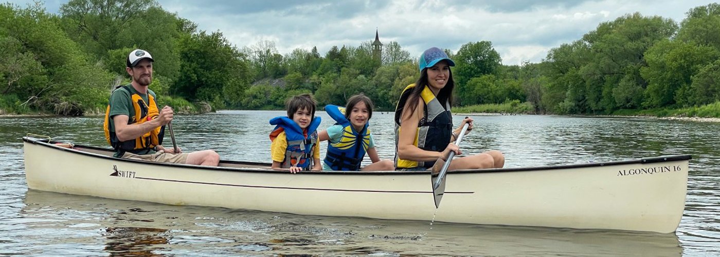 Family in canoe on river