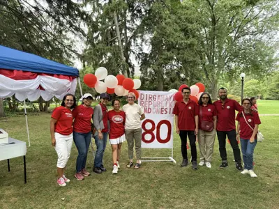 adults at festival posing for photo