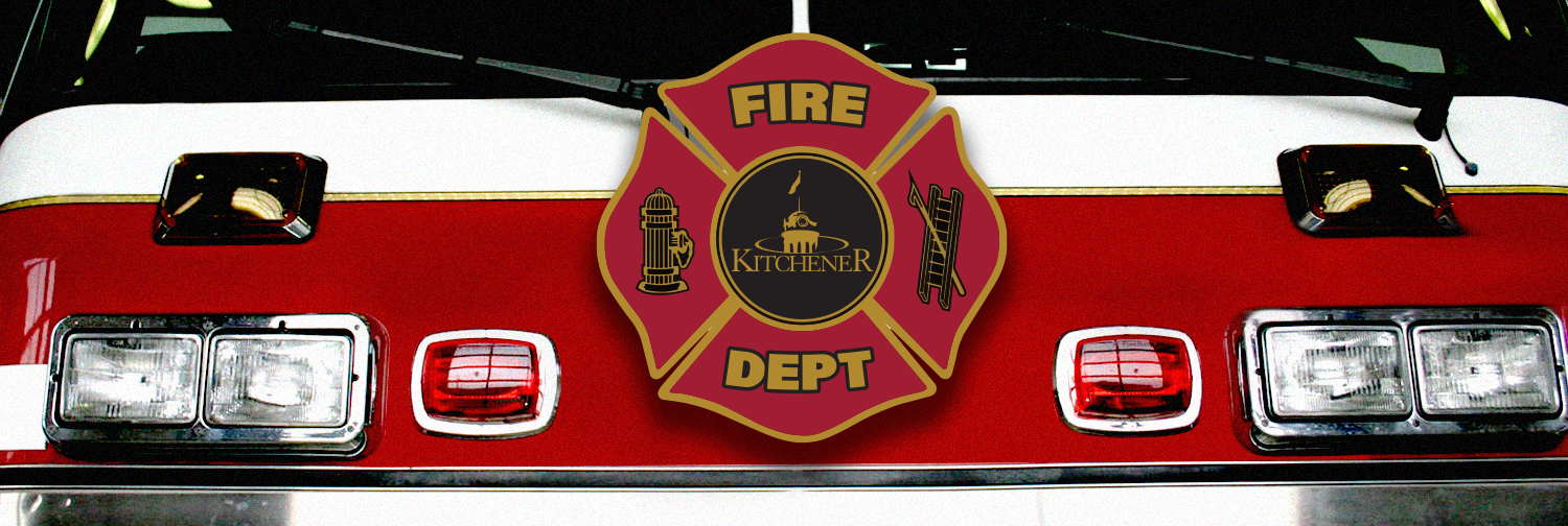 Front view of a Kitchener Fire truck with the Kitchener Fire logo on it