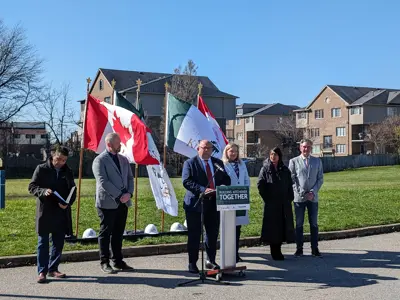 mayor, council and dignitaries at podium for media event