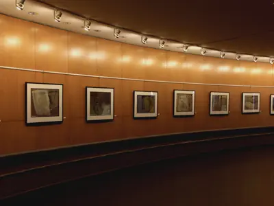 Pieces of art on the wall of the Rotunda Gallery at City Hall