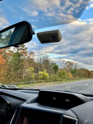 View looking out the front windshield of a car