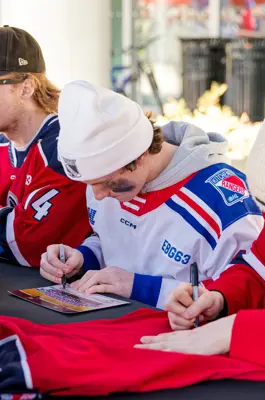 Kitchener Rangers player signing an autograph