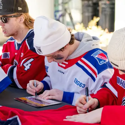 Kitchener Rangers player signing an autograph