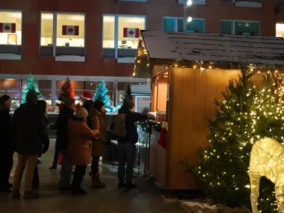vendor hut outside in the winter with people waiting in line