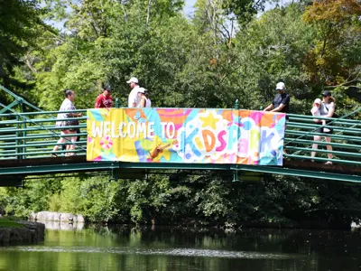 bridge with a sign that says welcome to kidspark
