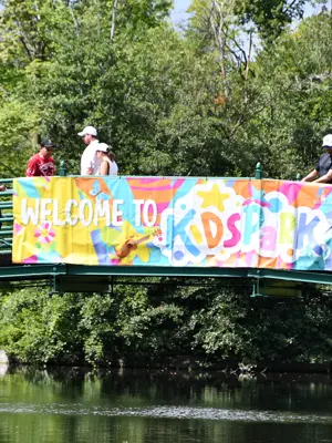 bridge with a sign that says welcome to kidspark
