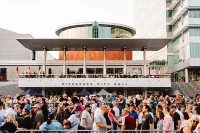 A crowd of people in front of City Hall at Wayback music festival