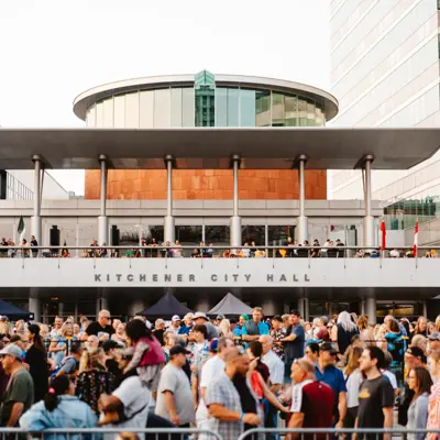 A crowd of people in front of City Hall at Wayback music festival