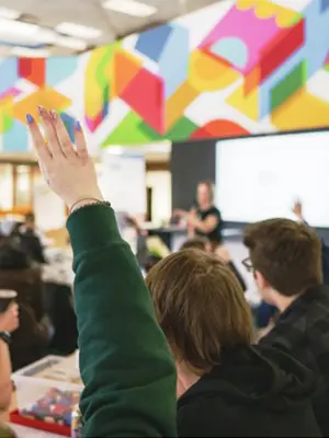 Participants watching a presenter