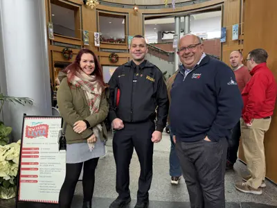 Mayor and police officer posing for photo