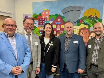 Council, mayor and community members posing for photos