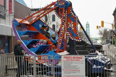 kids on swinging ship amusement ride