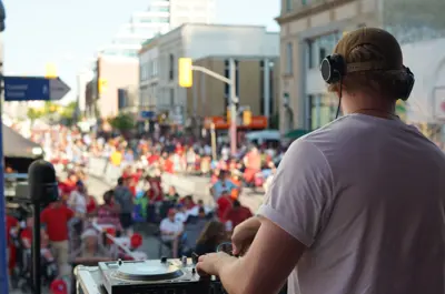 DJ playing music for patrons during Canada Day festivities 