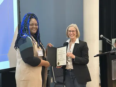 Councillor Chapman presenting certificate to community business owner