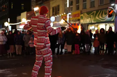 Man performing in front of patrons at Christkindl Market