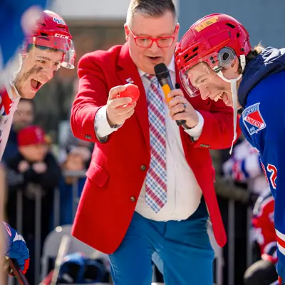 Two Kitchener Rangers player face off during the puck drop