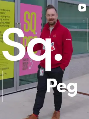 Square peg text with man wearing red sweater in image