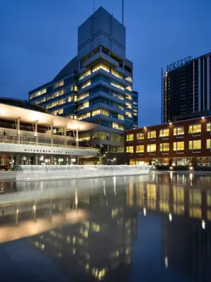Large office building lit up at night