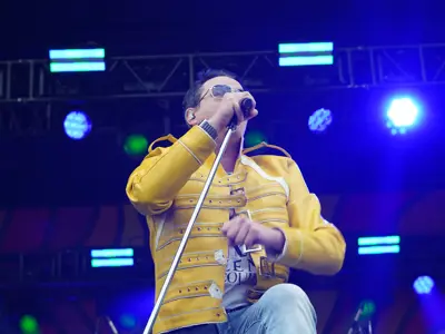 performer on stage singing into mic