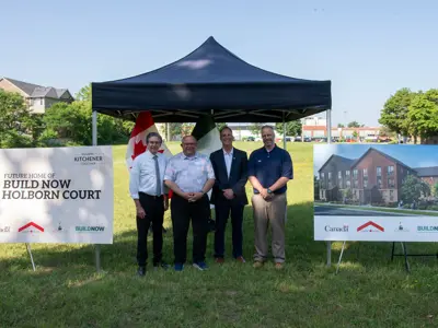 MP Tim Louis, Mayor Berry Vrbanovic, City Councillor Dave Schneider and Philip Mills, CEO of Habitat for Humanity Waterloo Region at site of future homeownership project 