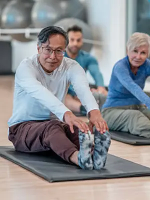 Elderly man stretching