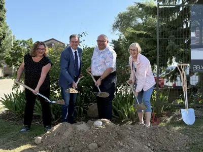 Councillor, Mayor and member of parliament shovelling dirt at ceremony