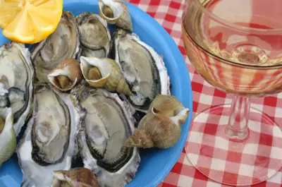 mussels and beer on a checkered table cloth