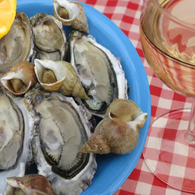 mussels and beer on a checkered table cloth