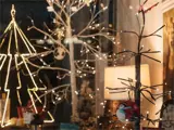 Display of lit trees and Christmas ornaments