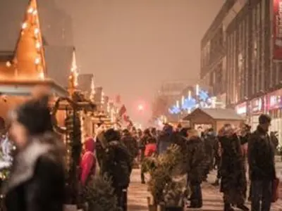 People walking around a street market at night