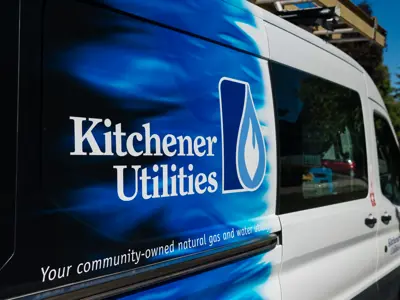Work van that says Kitchener Utilities on it