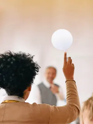 Woman with hand raised to ask a question