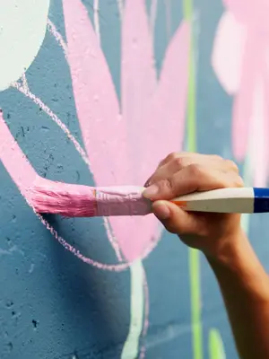 person painting mural