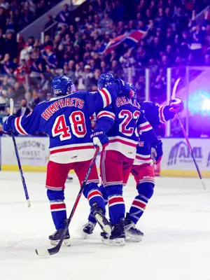 Members of the Kitchener Rangers celebrating a goal